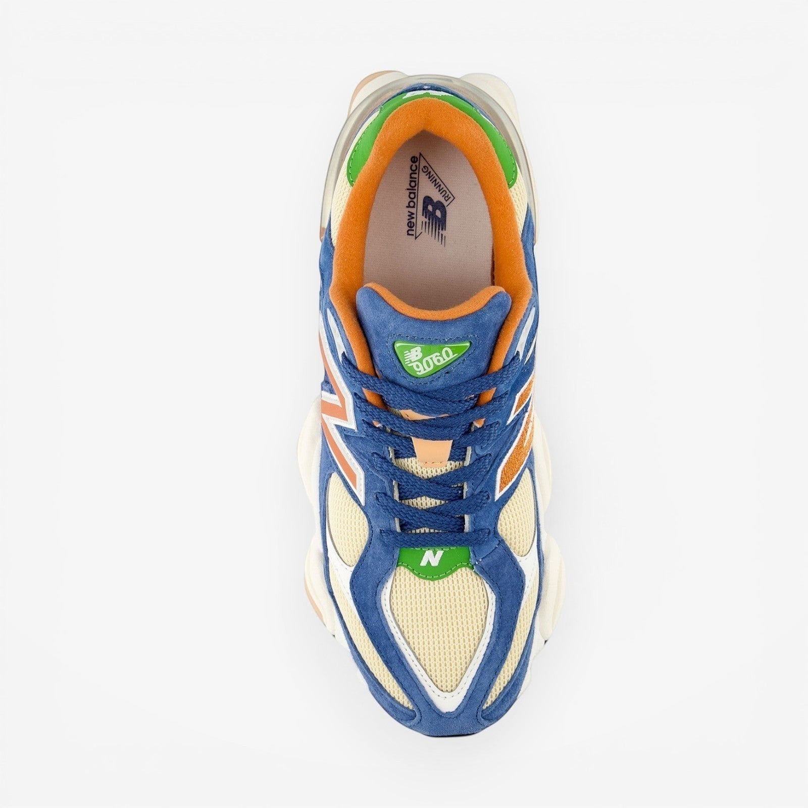 New Balance 9060 sneaker with blue, beige, orange, and green accents, top view, footwear