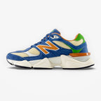 METRO New Balance U9060 Shoreline Blue sneakers featuring blue suede, cream mesh, and orange accents.