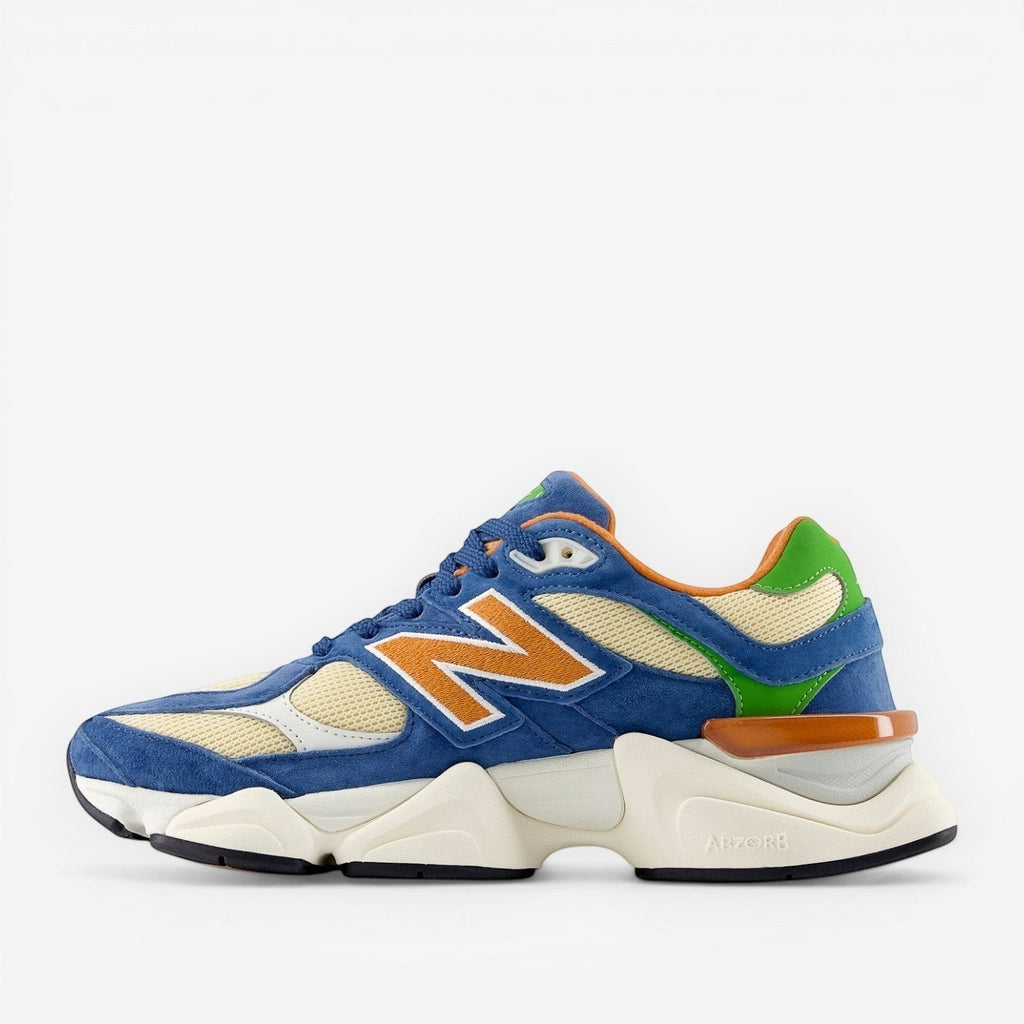 New Balance sneaker with blue suede, cream mesh, orange and green accents, stylish footwear