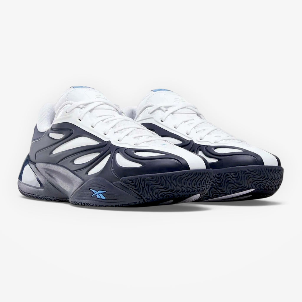 METRO Reebok Angel Reese 1 basketball shoes in navy, white, and peri blue with mesh upper and rubber traction sole.