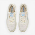 METRO Reebok Club C 85 Vintage low-top sneakers in chalk and essential blue leather with lace-up closure and rubber sole.