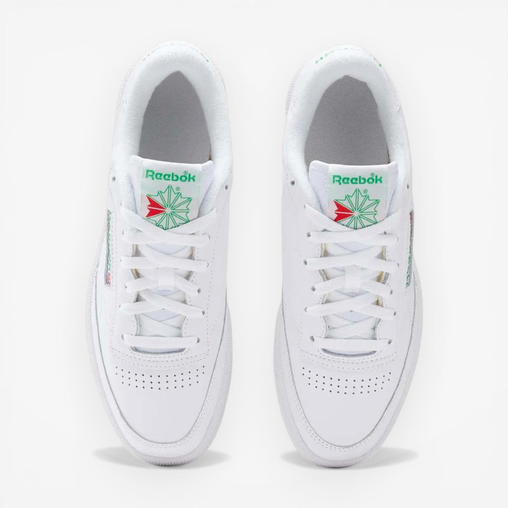 METRO Reebok Club C 85 white green leather low-top sneakers with lace-up closure and classic tennis shoe style.