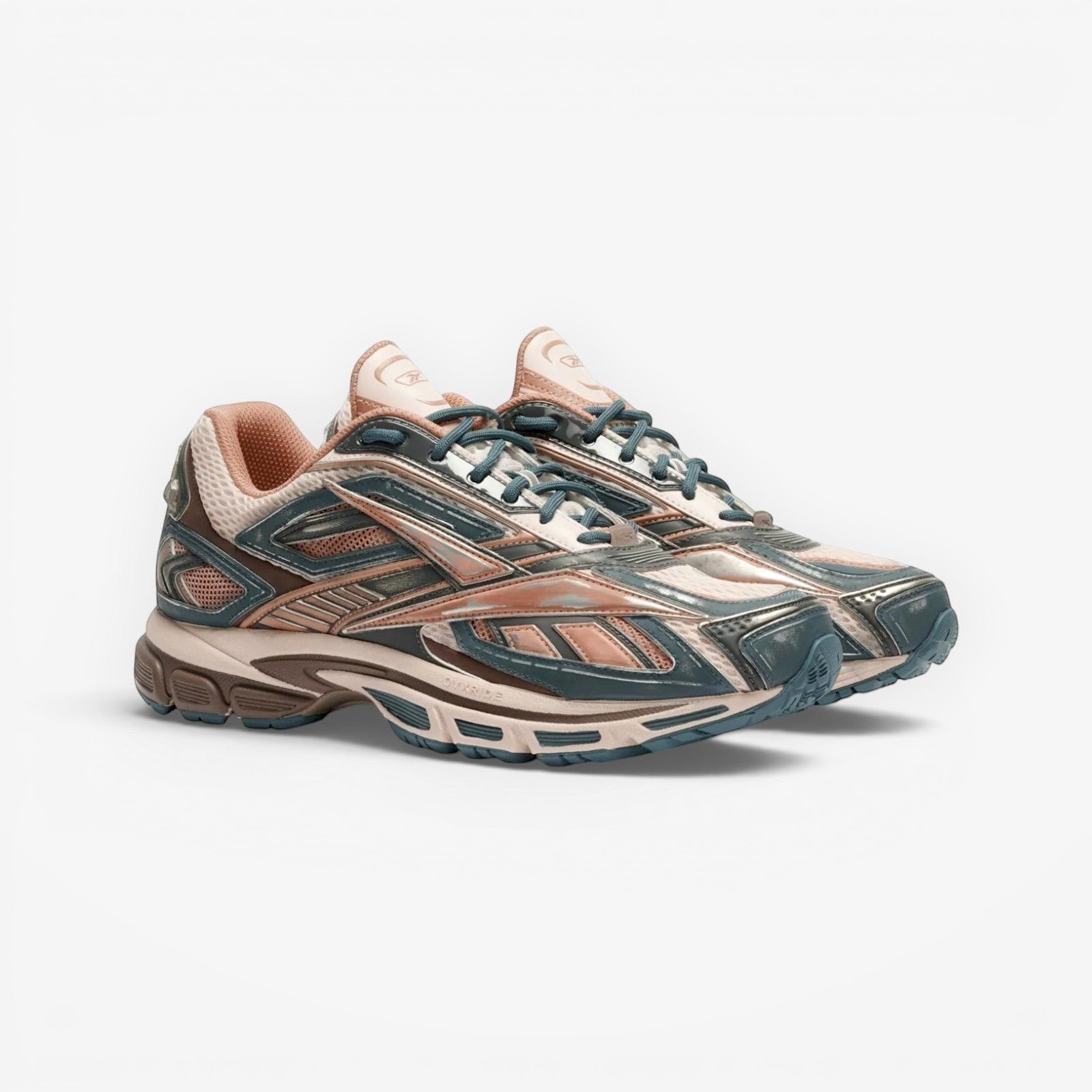 METRO Reebok Premier Road Ultra LTD running shoes in Gentle Pink, Pure Pink, and Midnight Tide. Mesh and synthetic overlays.