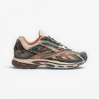 METRO Reebok Premier Road Ultra LTD running shoes in Gentle Pink, Pure Pink, and Midnight Tide. Mesh and synthetic overlays with DMX Ride cushioning.