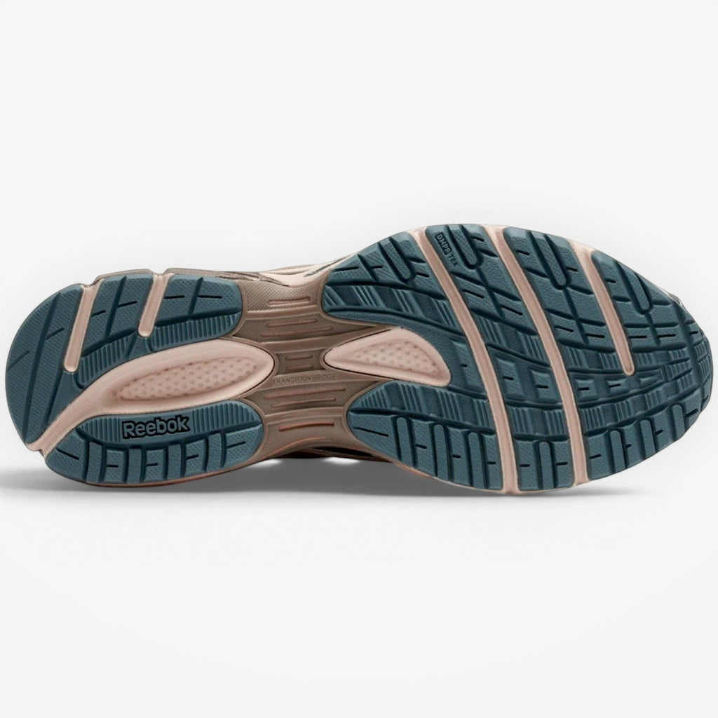 METRO Reebok Premier Road Ultra LTD running shoes in Gentle Pink, Pure Pink, and Midnight Tide. Features DMX Ride cushioning and rubber outsole.