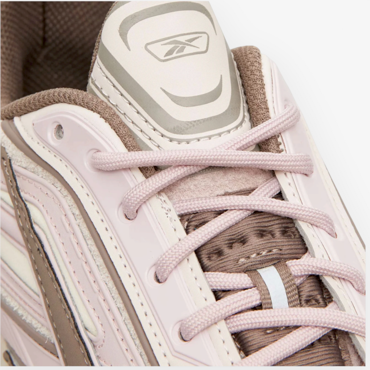 Metro Reebok Premier Road Ultra sneakers in elemental pink and grey with layered paneled upper and Vector branding.