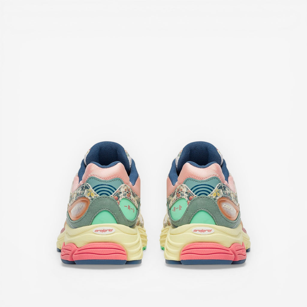 METRO Saucony ProGrid Omni 9 beige blue floral print sneakers with pink, yellow, and mint green accents.