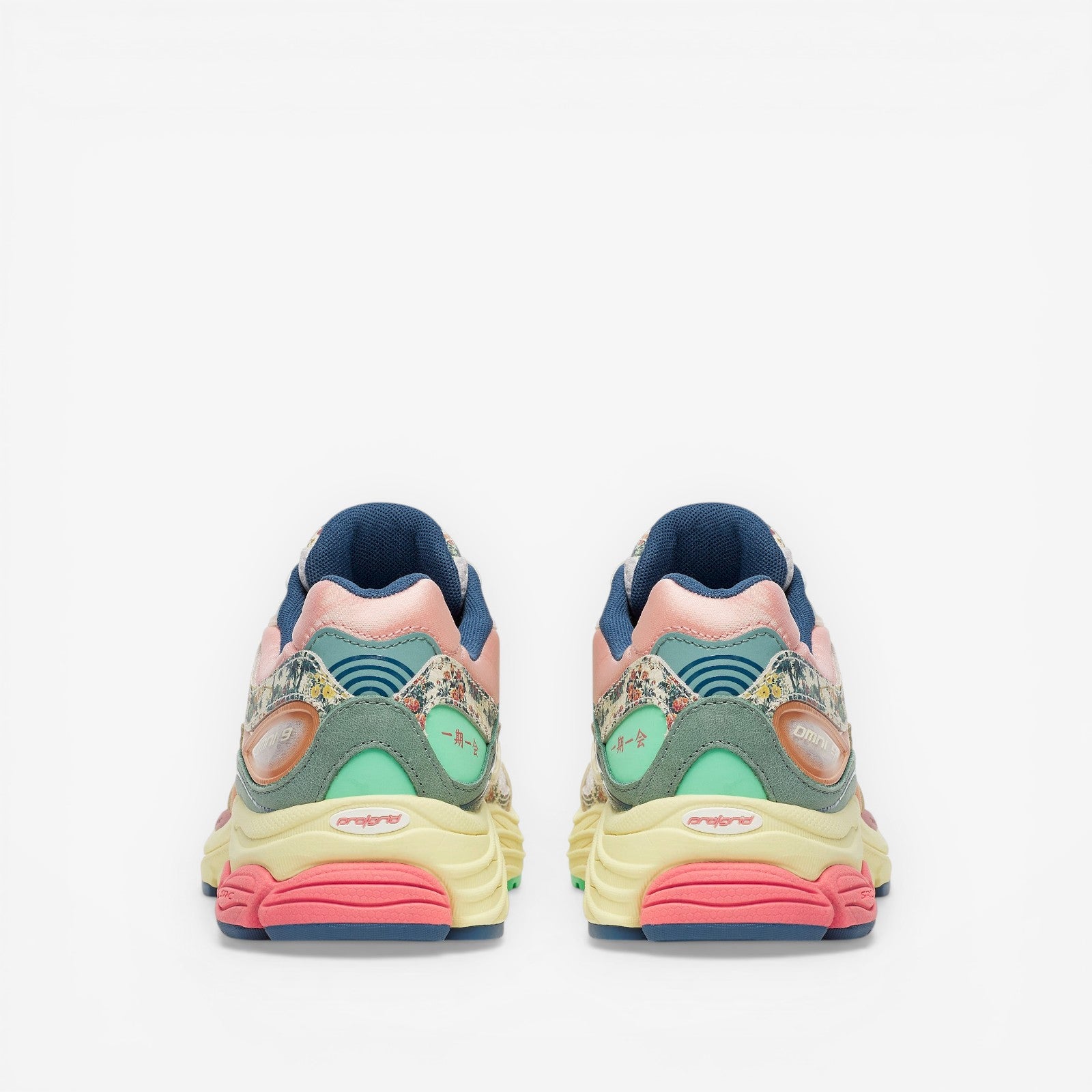 METRO Saucony ProGrid Omni 9 beige blue floral print sneakers with pink, yellow, and mint green accents.