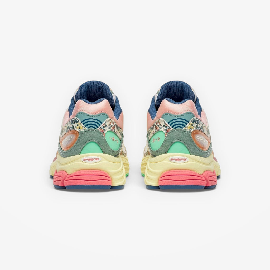 METRO Saucony ProGrid Omni 9 beige blue floral print sneakers with pink, yellow, and mint green accents.