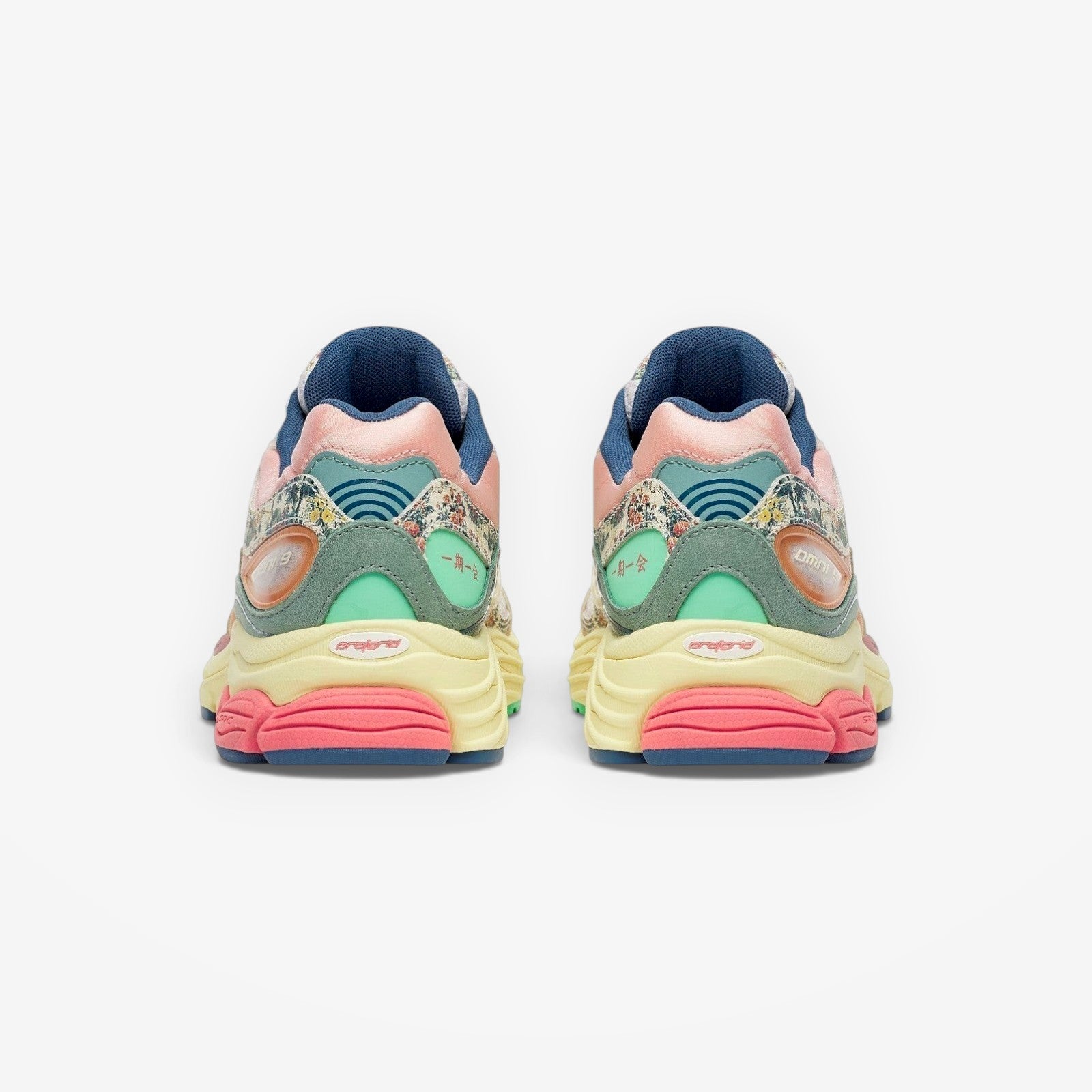 METRO Saucony ProGrid Omni 9 beige blue floral print sneakers with pink, yellow, and mint green accents.