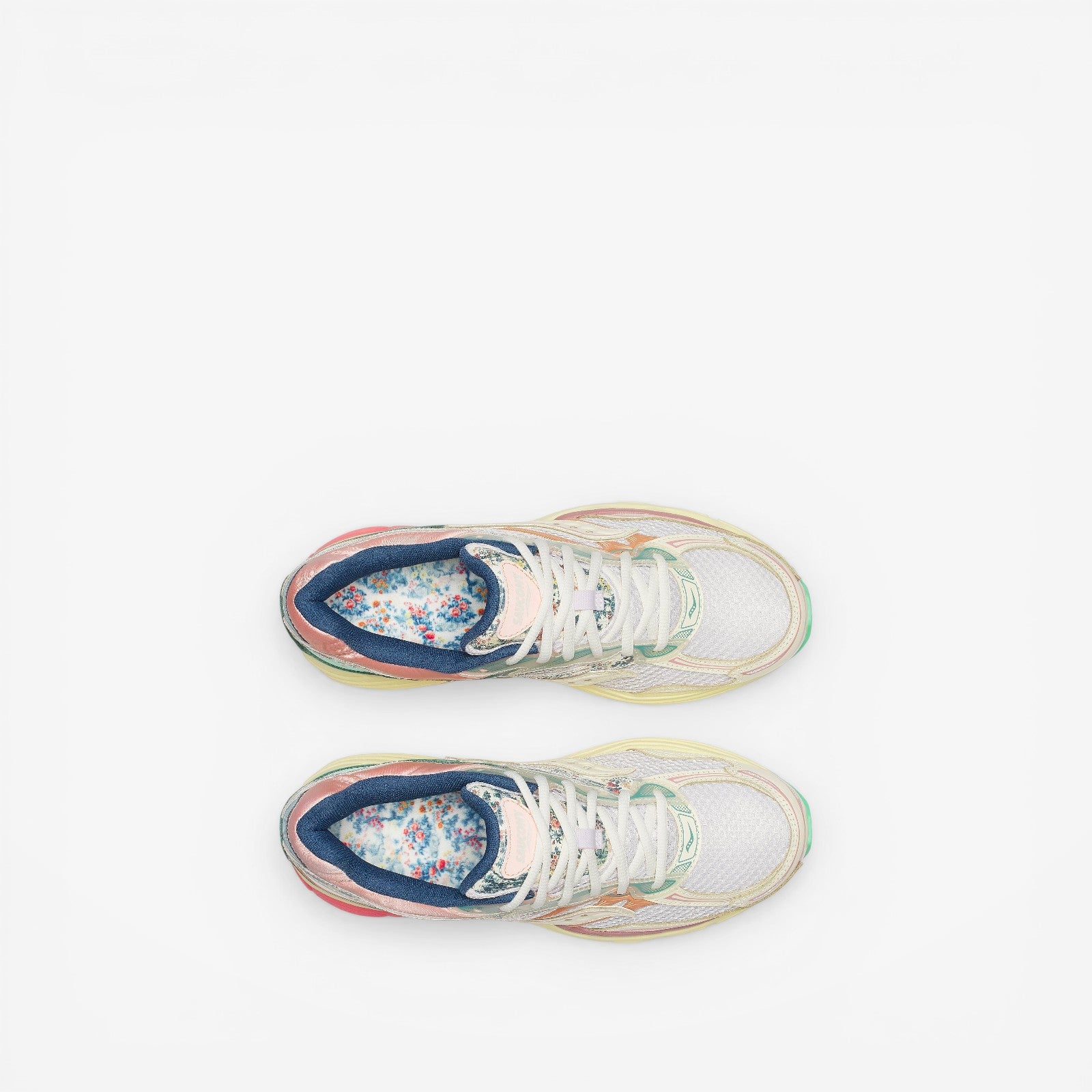 METRO Saucony ProGrid Omni 9 beige and blue mesh sneakers with floral insoles and reflective details.