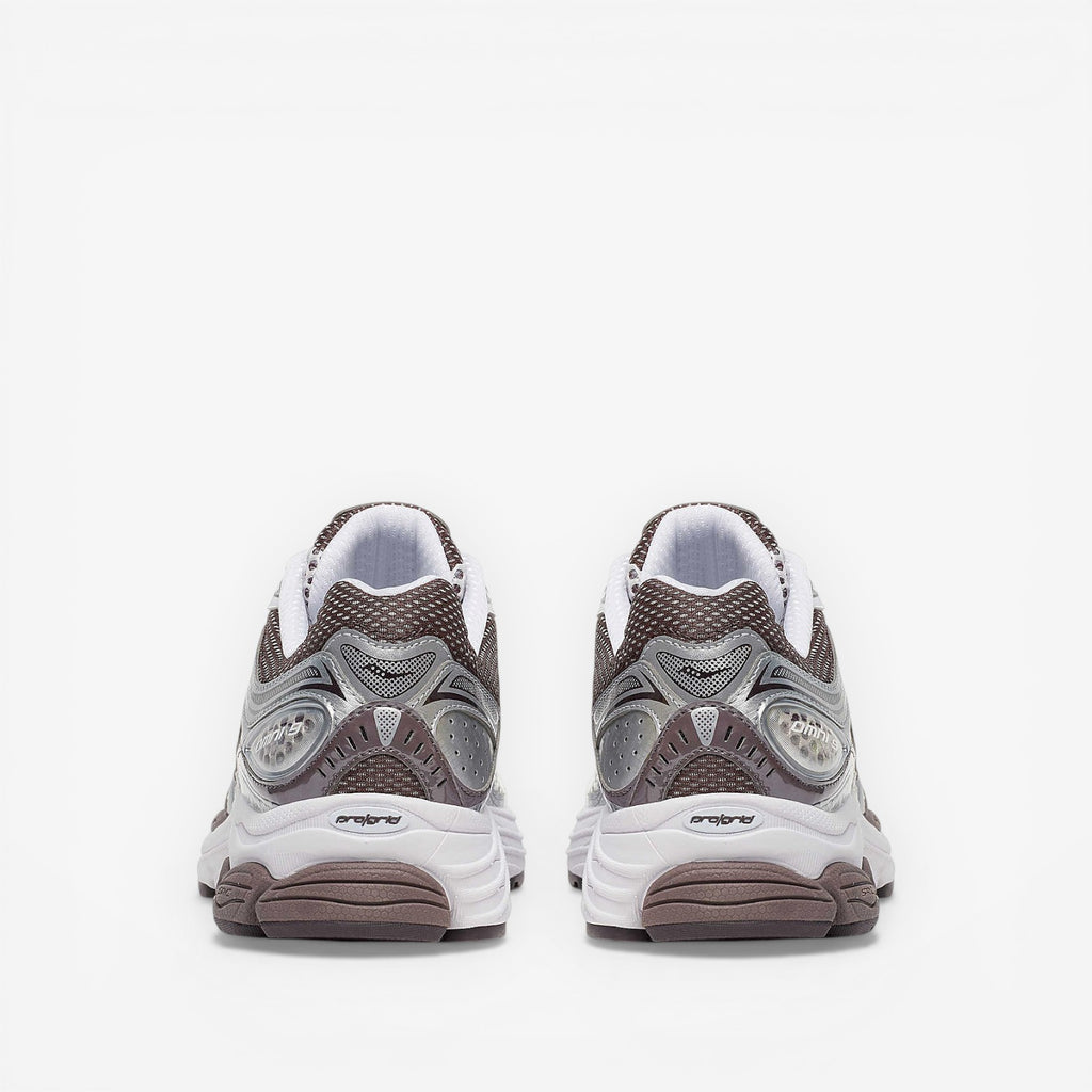 METRO ProGrid Omni 9 retro runner sneakers in white, brown, and silver mesh with synthetic overlays and ProGrid cushioning.