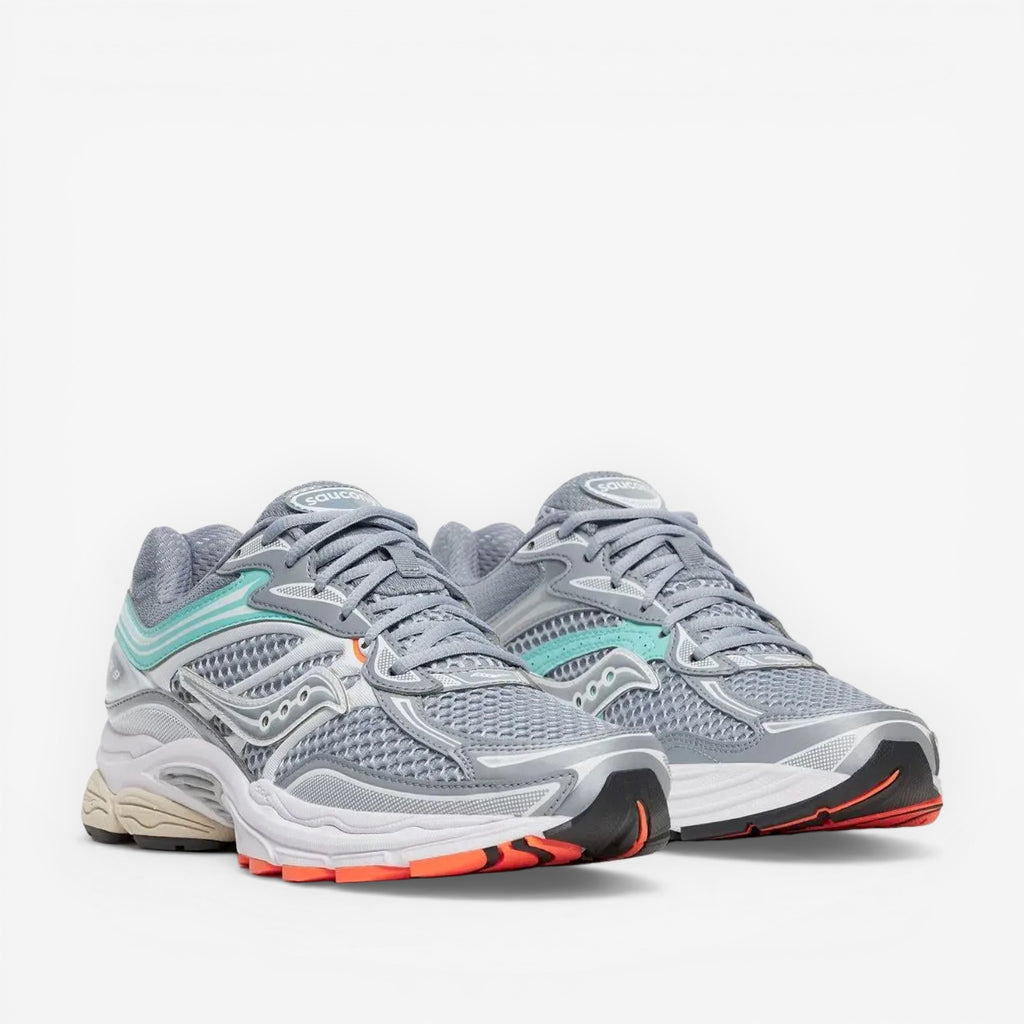 METRO ProGrid Omni 9 grey mesh sneakers with teal and silver accents and orange sole details.