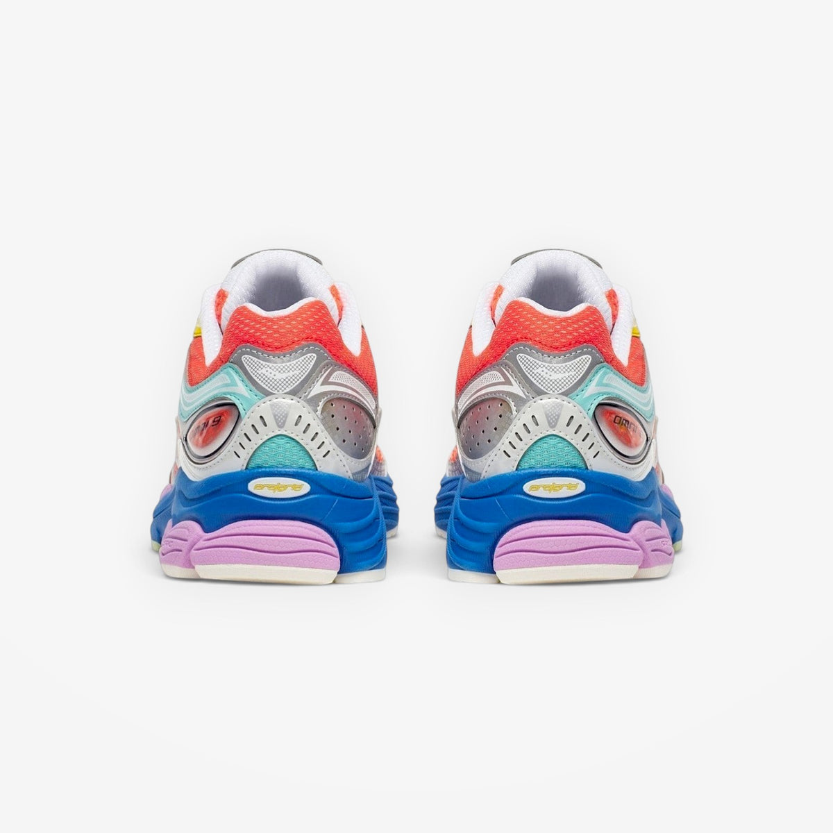 METRO Saucony Progrid Omni 9 retro runner in orange, silver, and multi-color with layered mesh and synthetic cage