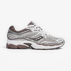 METRO ProGrid Omni 9 white and brown mesh sneakers with silver accents and ProGrid cushioning.
