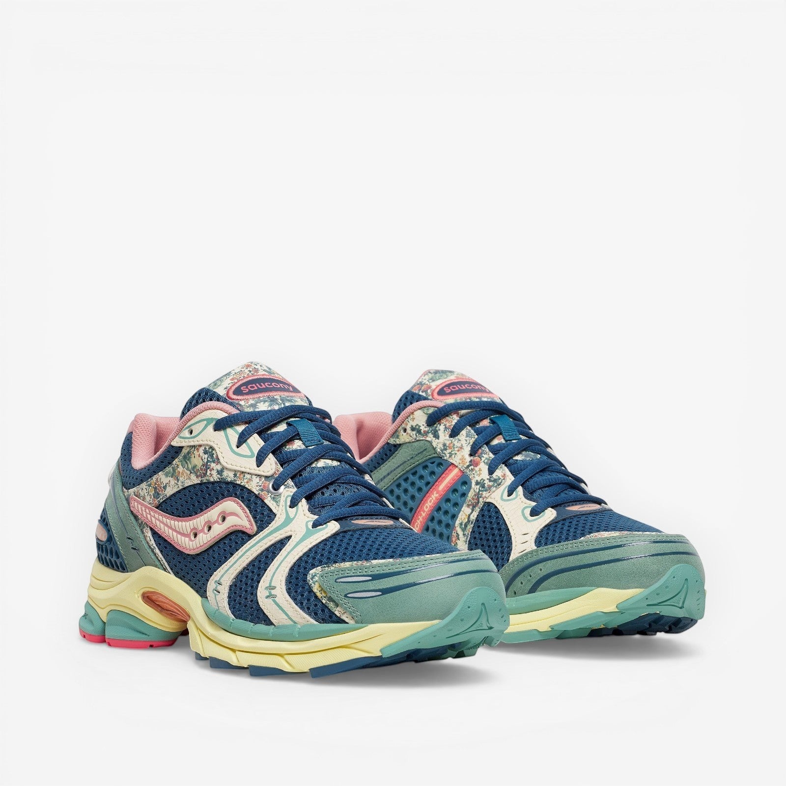 METRO Saucony ProGrid Triumph 4 blue beige mesh sneakers with floral print accents and pink lining. Lace-up low-tops.