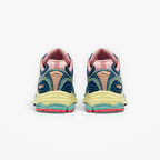 METRO Saucony ProGrid Triumph 4 beige and blue mesh sneakers with pink accents and layered design.