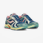 METRO Saucony ProGrid Triumph 4 blue beige mesh sneakers with floral print accents and pink lining. Lace-up low-tops.