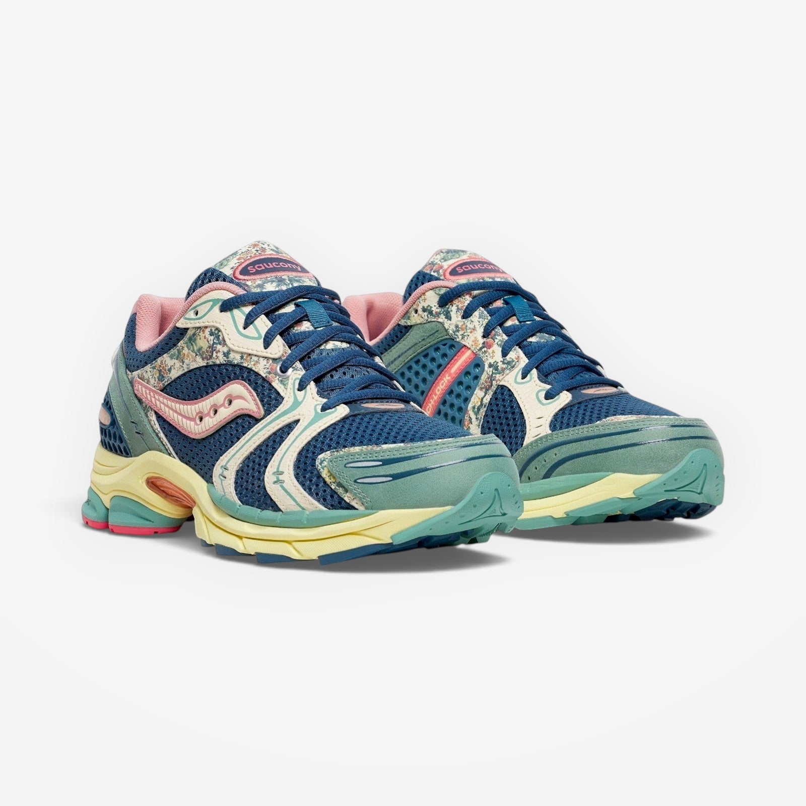 METRO Saucony ProGrid Triumph 4 blue beige mesh sneakers with floral print accents and pink lining. Lace-up low-tops.
