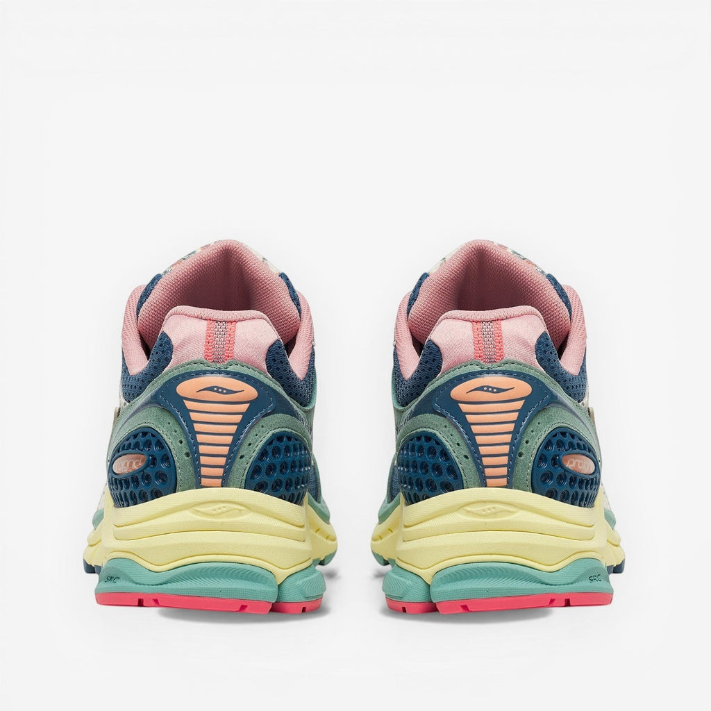 METRO Saucony ProGrid Triumph 4 beige and blue mesh sneakers with pink accents and layered design.