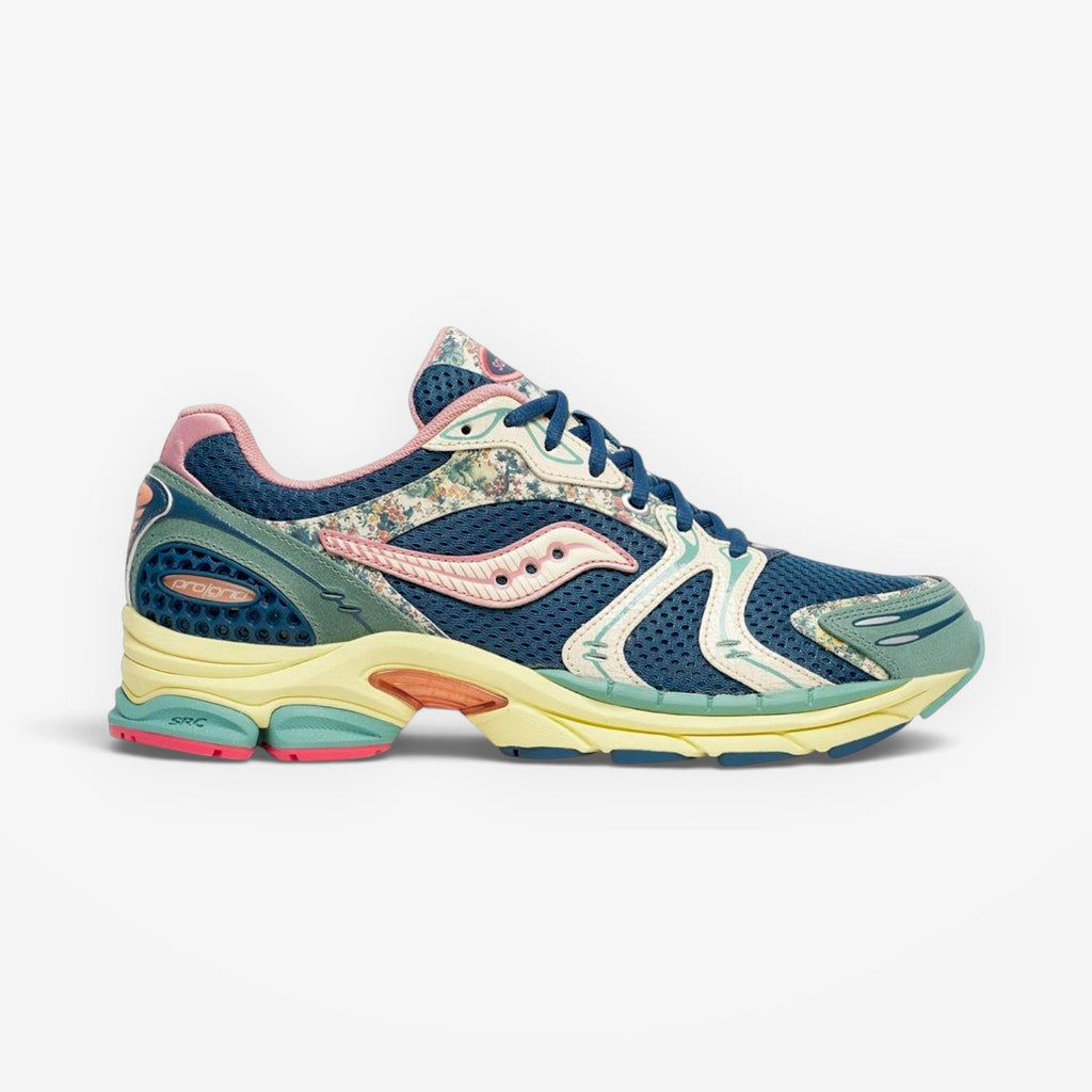 METRO Saucony ProGrid Triumph 4 blue beige floral mesh running sneakers with ProGrid cushioning.