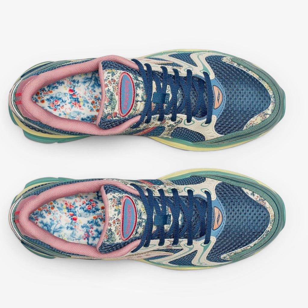 METRO Saucony ProGrid Triumph 4 blue beige floral print mesh sneakers with pink trim and blue laces.