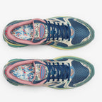 METRO Saucony ProGrid Triumph 4 blue beige floral print mesh sneakers with pink trim and blue laces.