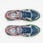 METRO Saucony ProGrid Triumph 4 blue beige floral print mesh sneakers with pink trim and blue laces.