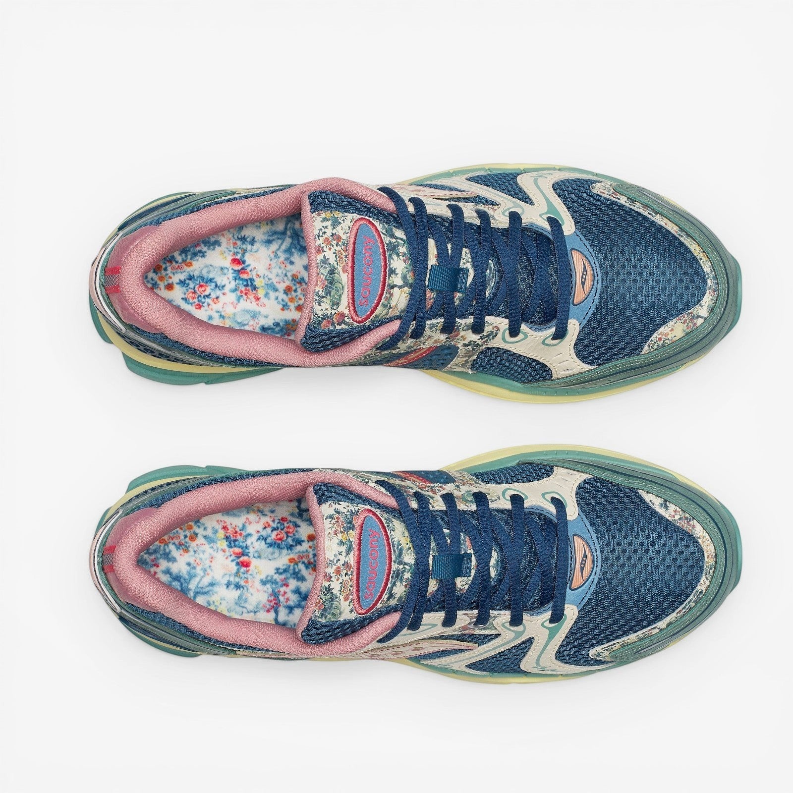 METRO Saucony ProGrid Triumph 4 blue beige floral print mesh sneakers with pink trim and blue laces.