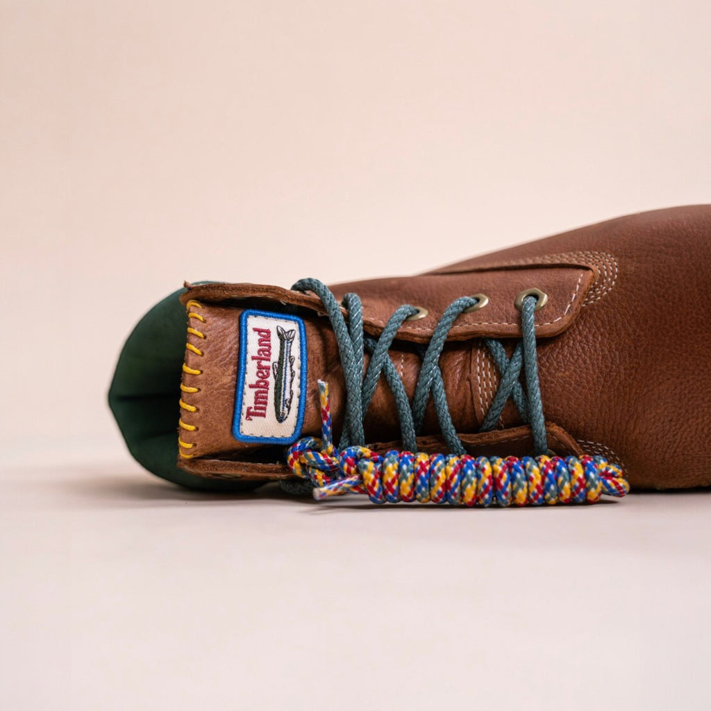 Brown leather sneaker with blue laces, close-up, footwear, new balance, asics, hats, fitted caps, new era.