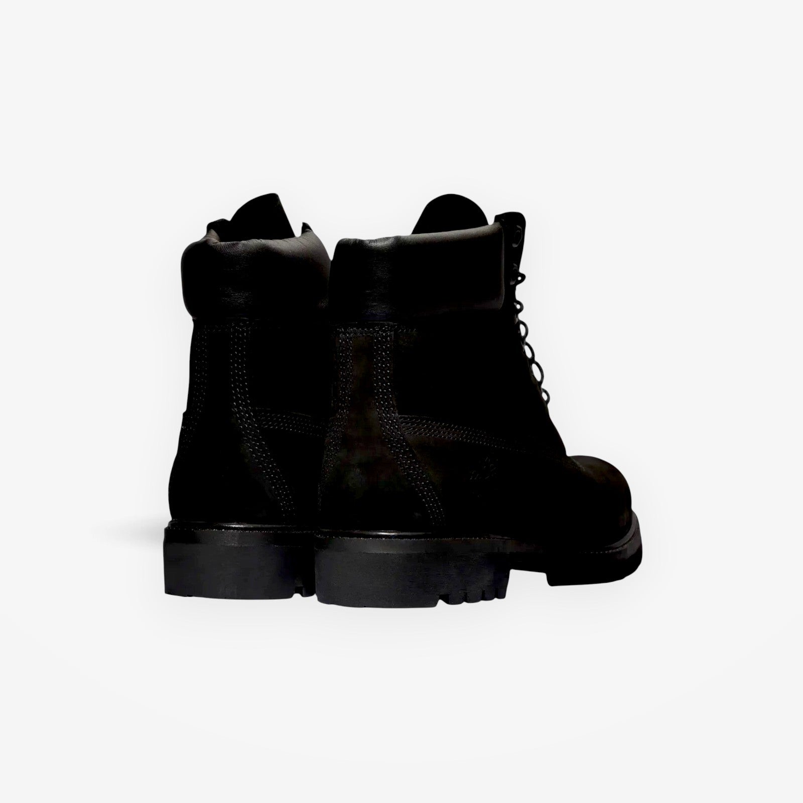 METRO Timberland 6-Inch Premium waterproof boots in black, showing the rear view with padded collar and rubber lug sole.