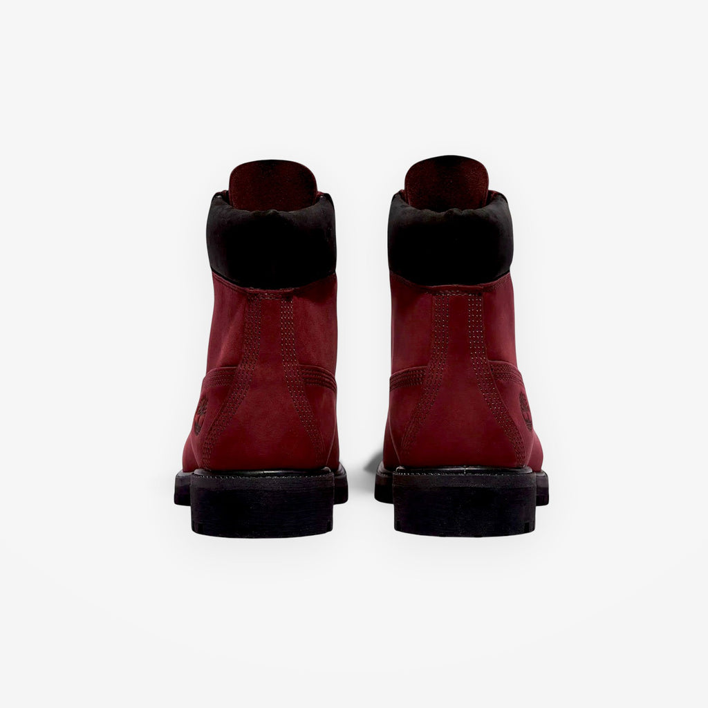 Rear view of METRO Timberland Premium 6-Inch waterproof boots in burgundy nubuck leather with black padded collars.