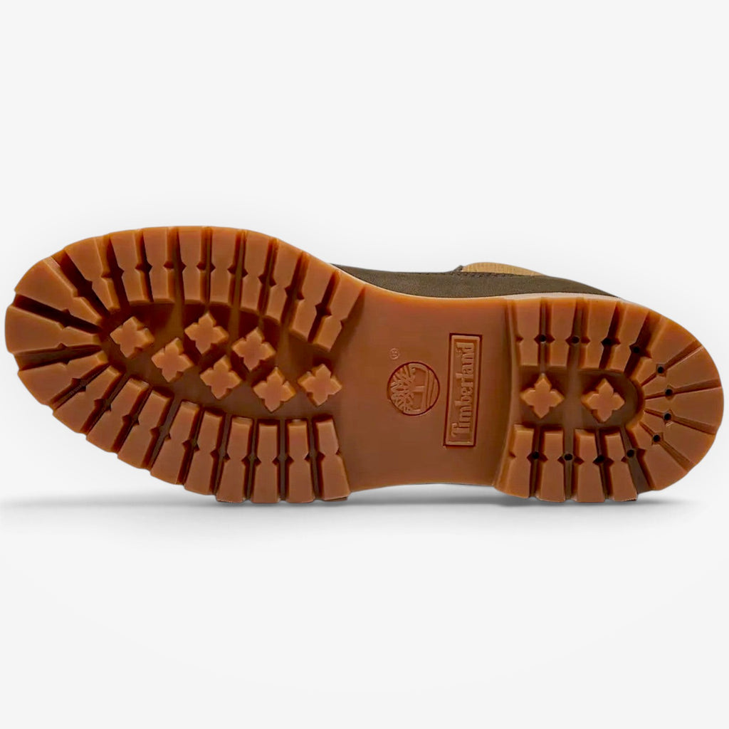 METRO Timberland dark brown waterproof boot showing the durable rubber lug outsole with traction pattern