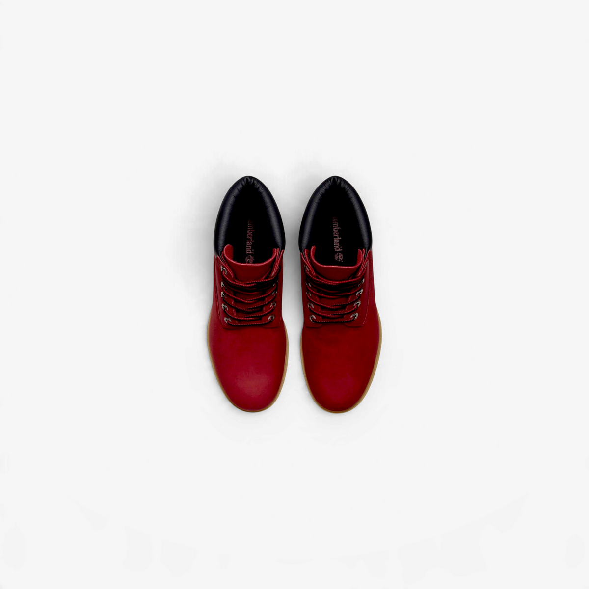 METRO Timberland 6-inch premium waterproof boots in dark red leather with black padded collars and rubber lug soles.