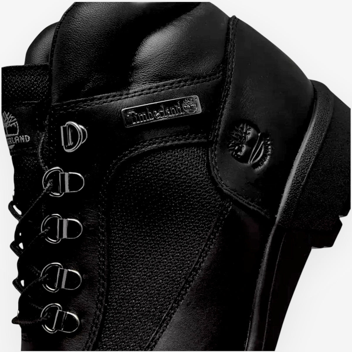 METRO Timberland Euro Hiker Mid boot in black leather with metal lace hardware and embossed logo detail.