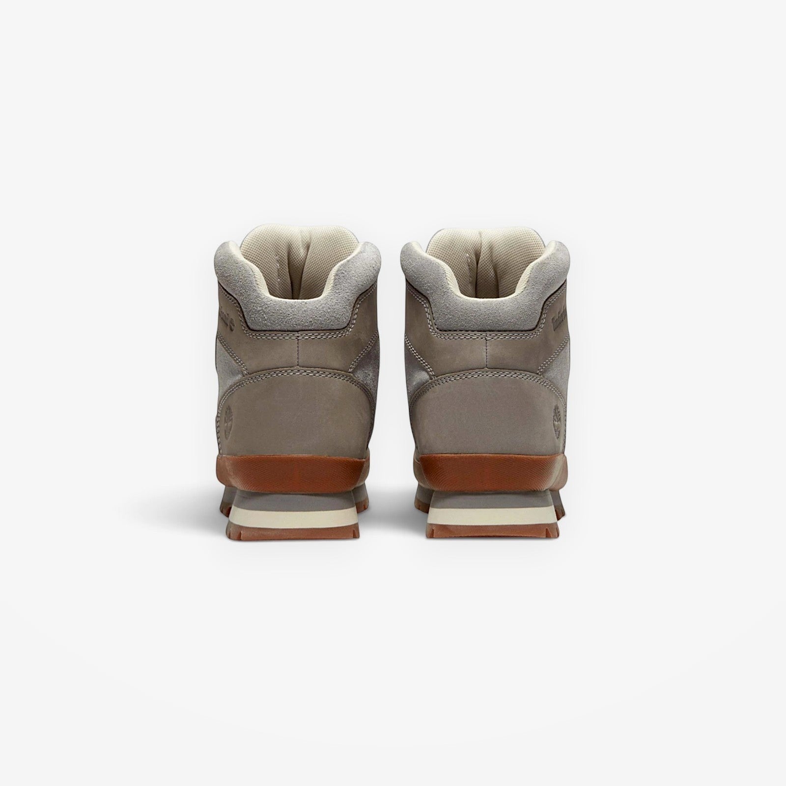 METRO Timberland Euro Hiker boots in medium grey leather with a brown midsole and padded collar, rear view.