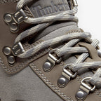 Close-up of METRO Timberland Euro Hiker boots in medium grey suede with metallic D-ring lacing and grey laces