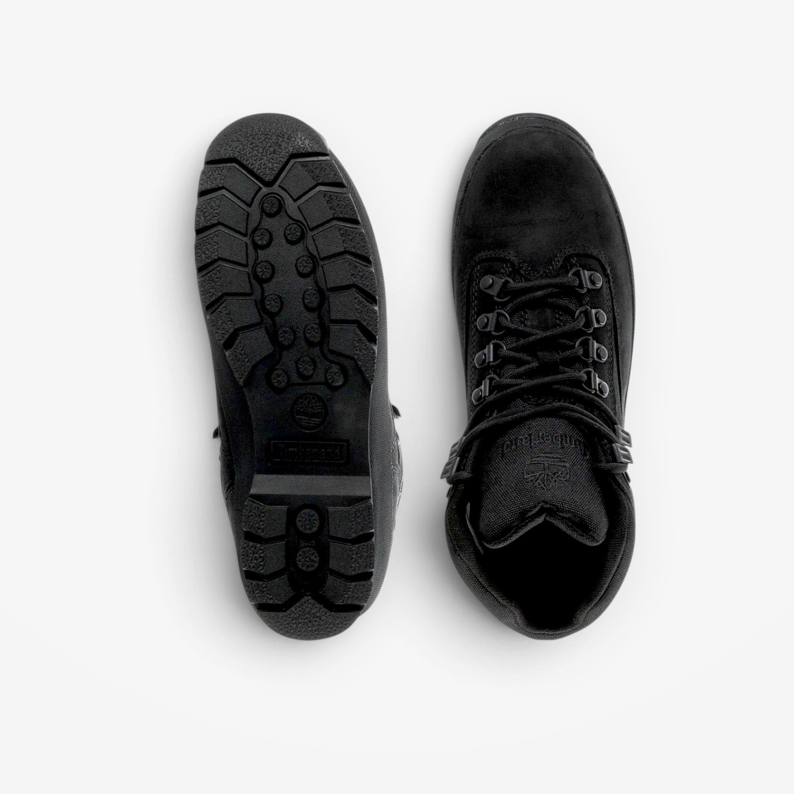 METRO Timberland Euro Hiker Mid boots in black, showing the top view and the durable rubber lug outsole.