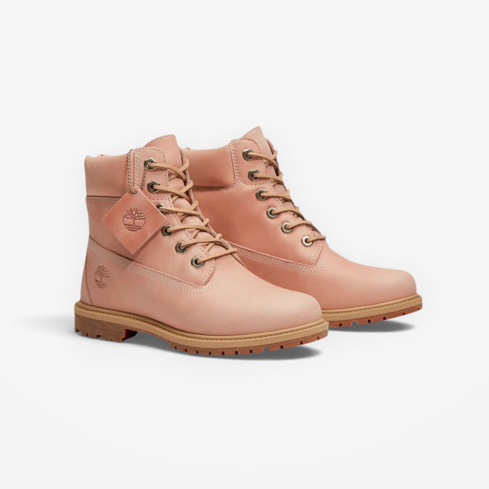 METRO Women’s Timberland Premium 6-Inch Boot in light pink nubuck leather with lace-up closure and rubber lug sole.