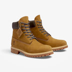 METRO Timberland Premium 6-Inch waterproof boots in olive nubuck leather with dark brown padded collars and lug soles.