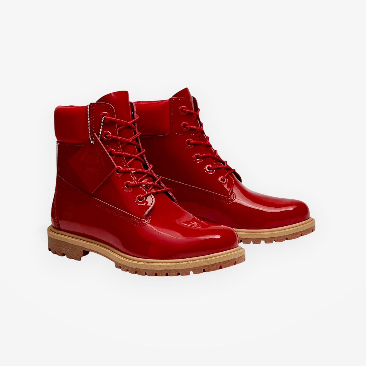 METRO Timberland women's red patent leather 6-inch waterproof boots with rubber lug soles and lace-up closure.