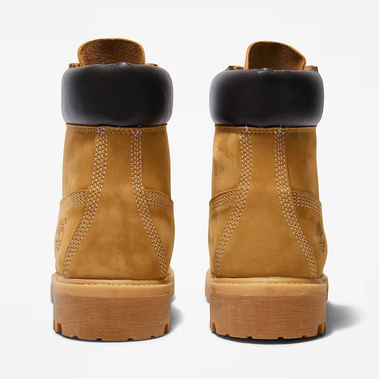 METRO Timberland Premium 6-Inch waterproof boots in wheat leather with dark brown padded collars, rear view.