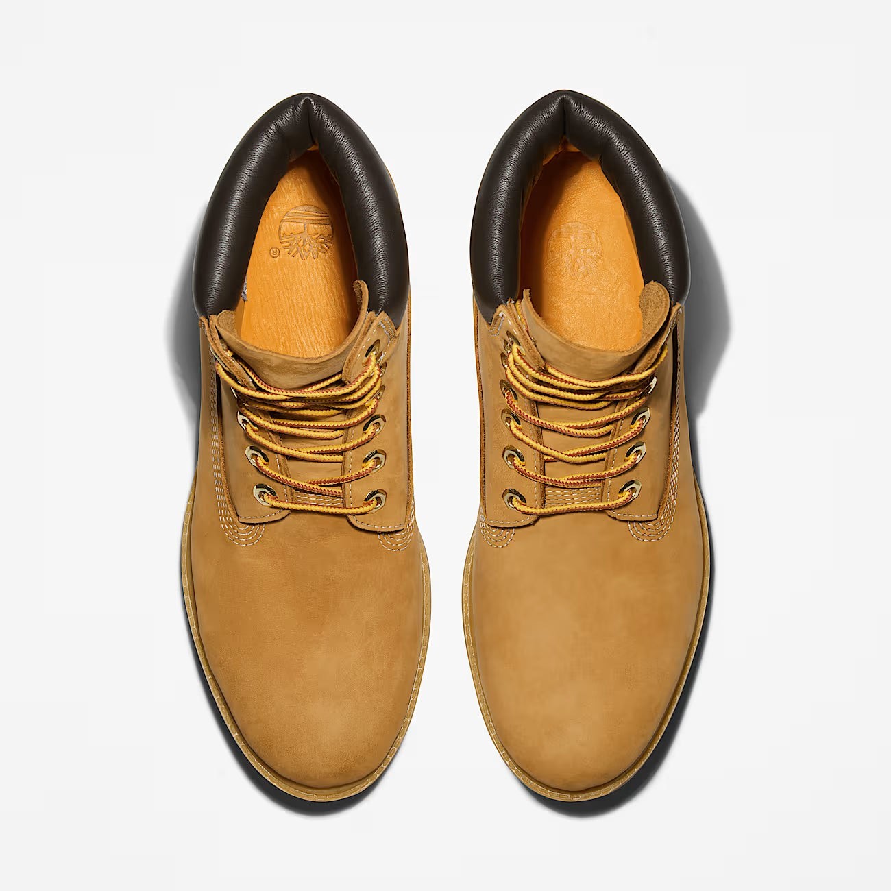 METRO Timberland Premium 6-Inch waterproof boots in wheat leather with a dark brown padded collar and lace-up closure.