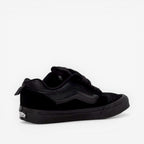 Black low-top sneaker with textured panels, suitable for new balance, asics, footwear, sneakers