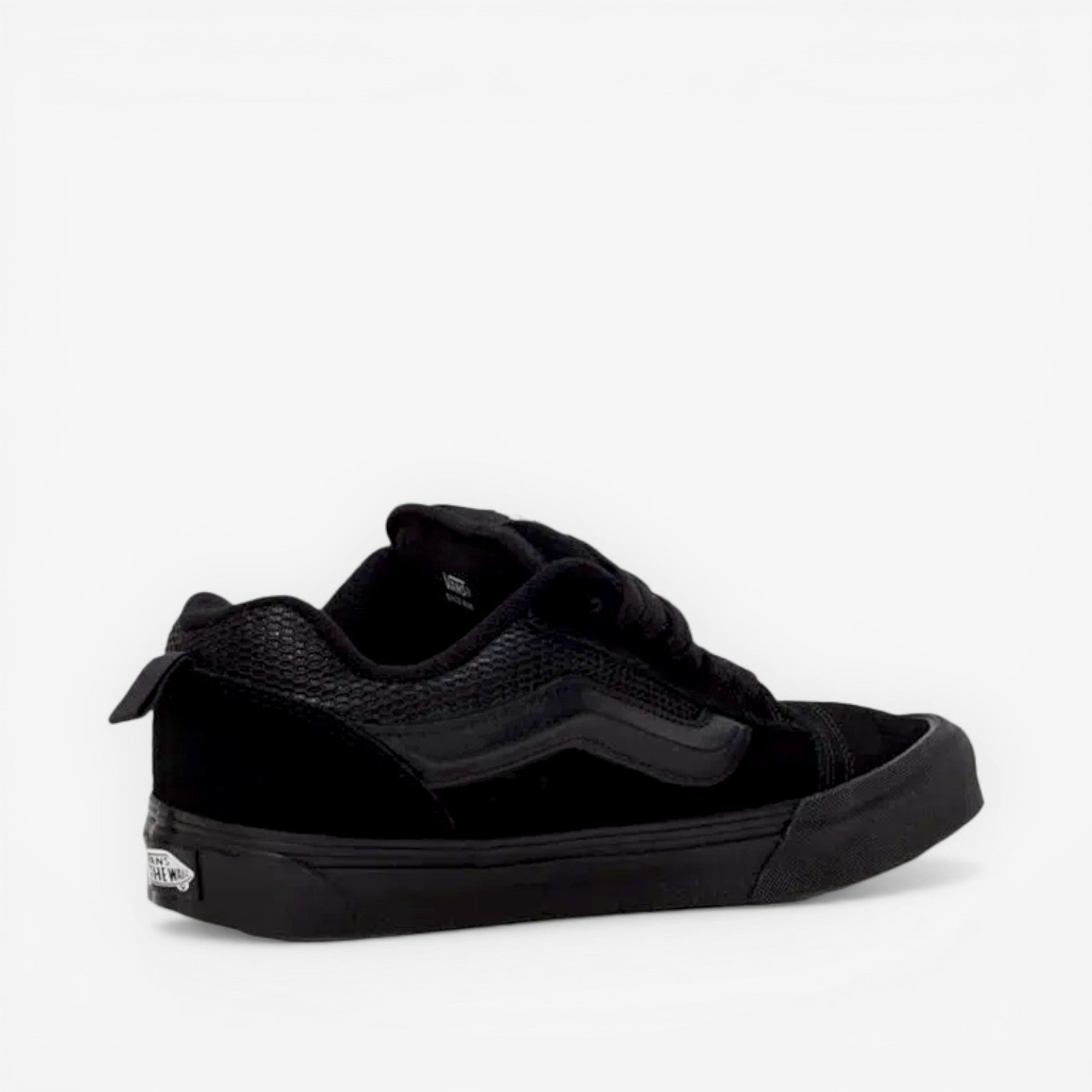 Black low-top sneaker with textured panels, suitable for new balance, asics, footwear, sneakers