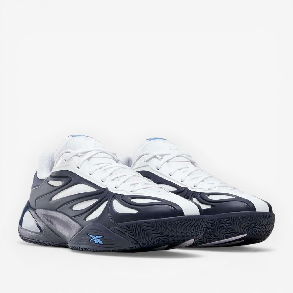 METRO Reebok Angel Reese 1 basketball shoes in navy, white, and peri blue with mesh upper and supportive overlays.