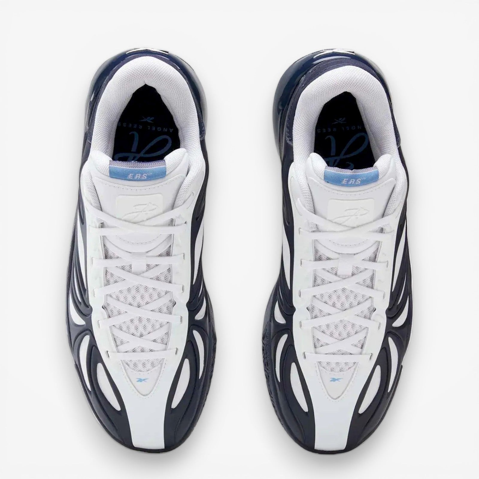 METRO Reebok Angel Reese 1 basketball shoes in navy, white, and peri blue with mesh upper and supportive overlays.