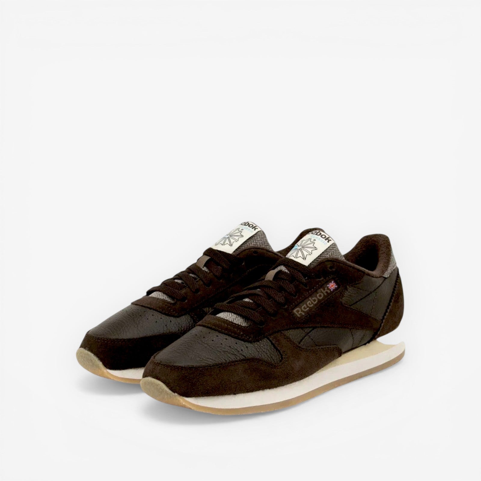 METRO Reebok Classic Leather 1983 Vintage Dark Brown leather sneakers with EVA cushioning and rubber outsole.