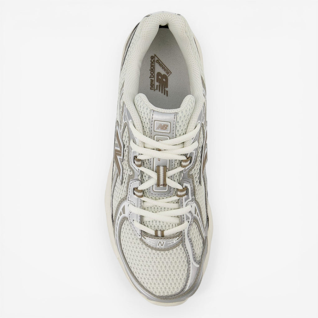 New Balance sneaker in white and grey, mesh upper, top view, classic athletic footwear
