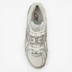 New Balance sneaker in white and grey, mesh upper, top view, classic athletic footwear